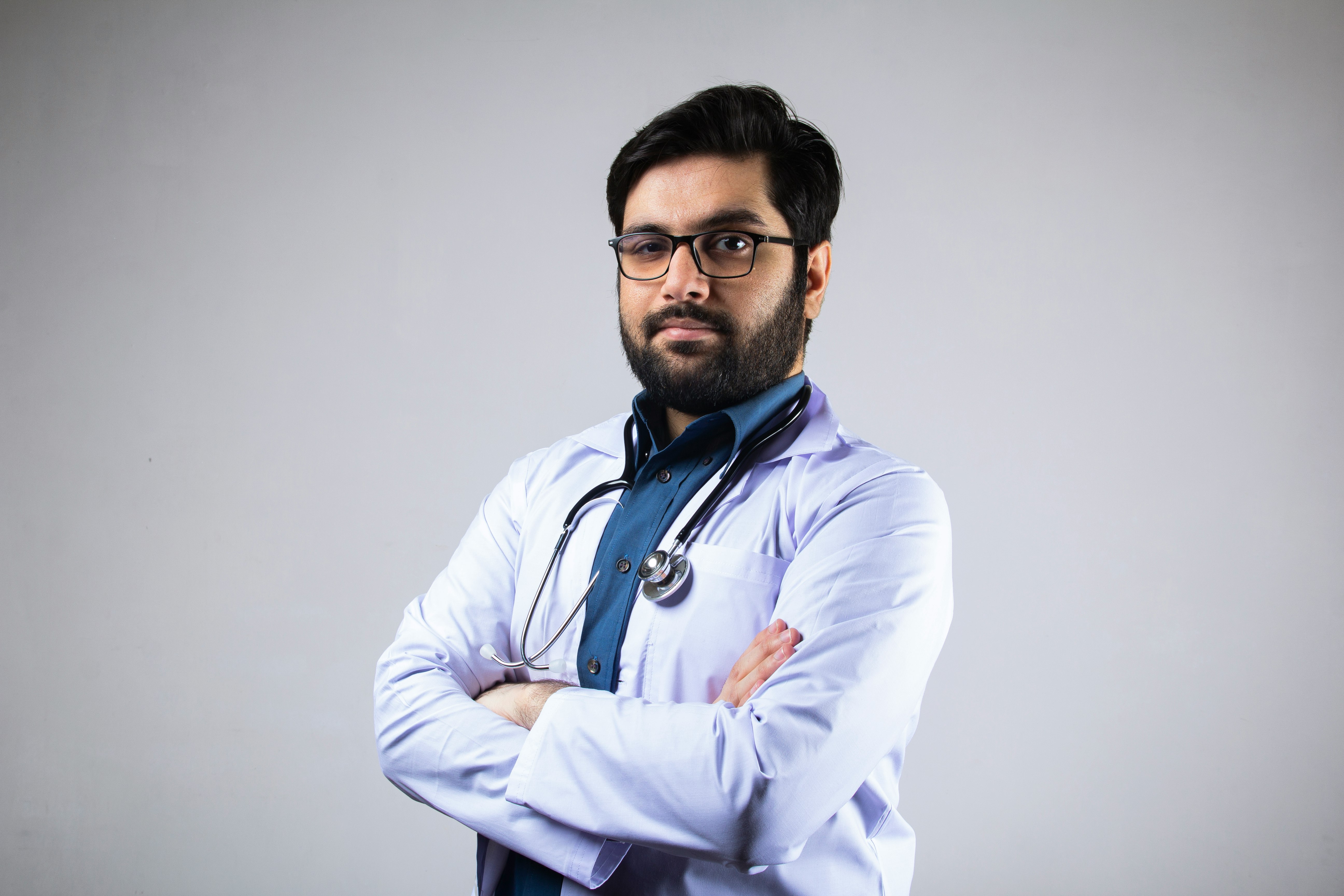 A doctor wearing stethoscope and medical coat